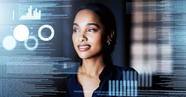 A confident woman with a nose ring and hoop earrings is looking thoughtfully at a transparent screen displaying various digital data visualizations, including graphs, charts, and code. The background is dimly lit, emphasizing the illuminated data elements on the screen.