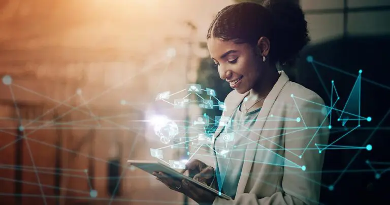 Smiling woman in a business suit holds a digital tablet with futuristic technology icons and network lines floating around her, symbolizing connectivity and digital advancements. This image represents future-of-work trend predictions for 2025 and beyond, highlighting themes of innovation and transformation in the workplace.