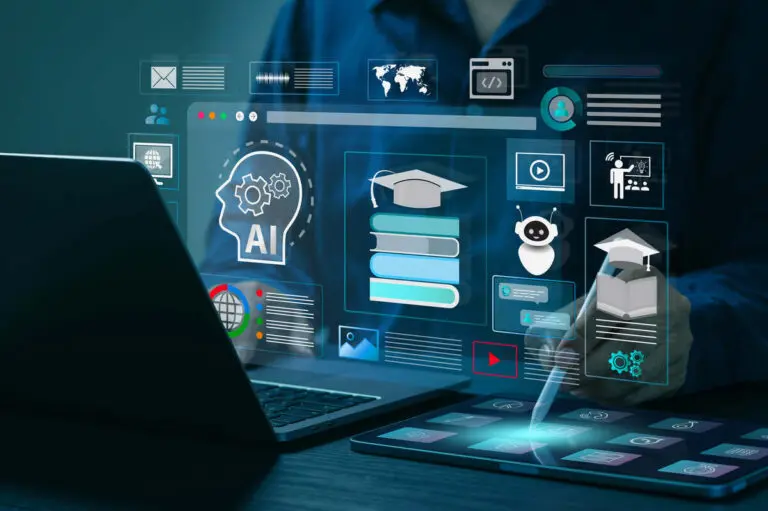 An image of a person sitting at a desk in front of a computer with floating digital icons like the human brain, books, a small robot, a graduation cap and charts all to represent EdTech Jobs and Hiring EdTech Talent