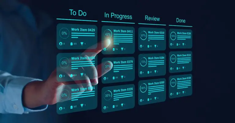 A digital task management board with columns labeled "To Do," "In Progress," "Review," and "Done." Each column contains multiple work items displayed in a sleek, futuristic interface with progress percentages, task details, and icons for collaboration and achievements. A hand interacts with the board, selecting a task in the "In Progress" column. The overall color scheme is dark with glowing blue and white accents, giving a modern and high-tech appearance.