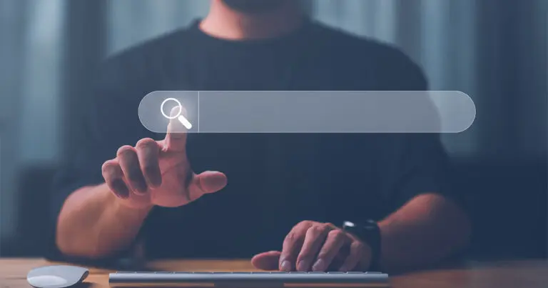 A man in a black shirt taps a floating symbol of a magnifying glass within a search bar to represent search engines, SEO, search engin optimization, generative engine optimization, and generative AI capabilities