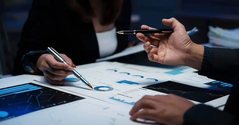 Business professionals reviewing data charts and analytics, symbolizing what enterprise consulting spend reveals about the future of hiring and talent strategy.