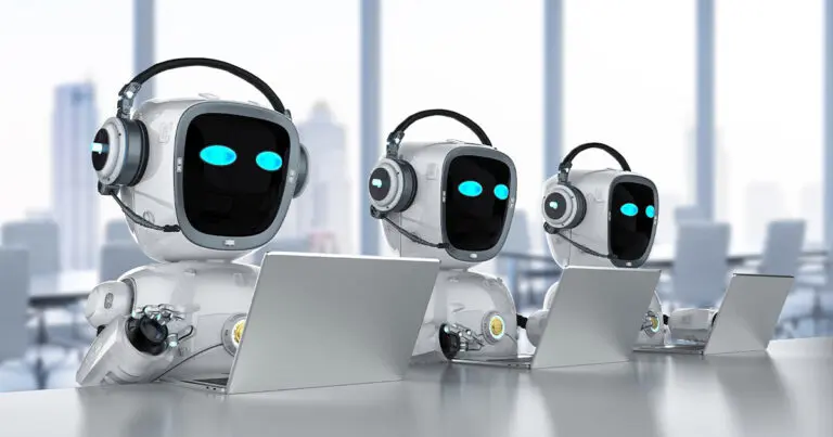Three humanoid robots with glowing blue eyes and headsets sit in a modern office setting, each working at a laptop. The background shows large windows with a blurred view of a city skyline, illustrating a futuristic concept of AI assistants performing human tasks in a professional environment.
