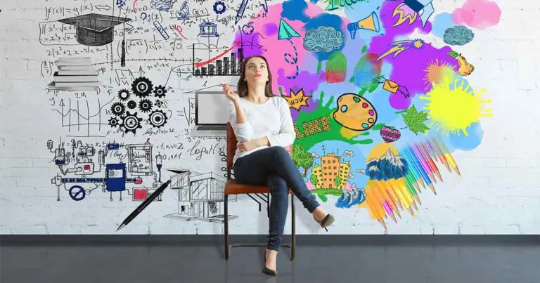 Woman sitting thoughtfully against a wall split between technical sketches and colorful creative drawings.