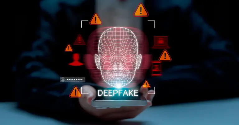 A glowing wireframe face hovers above a smartphone held in someone’s hands, surrounded by red warning icons and security symbols. The word “DEEPFAKE” appears beneath the digital face, highlighting concerns about identity manipulation and cybersecurity risks