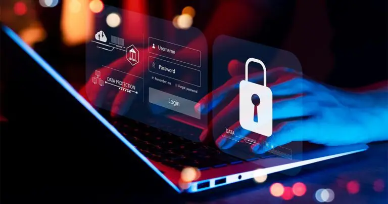 Hands type on a laptop keyboard while translucent security graphics float above the screen, including a login form labeled “Username” and “Password” and a large padlock icon. The dark, high-contrast scene uses red and blue lighting to convey identity security, digital risk, data protection, and the vulnerability of online logins.