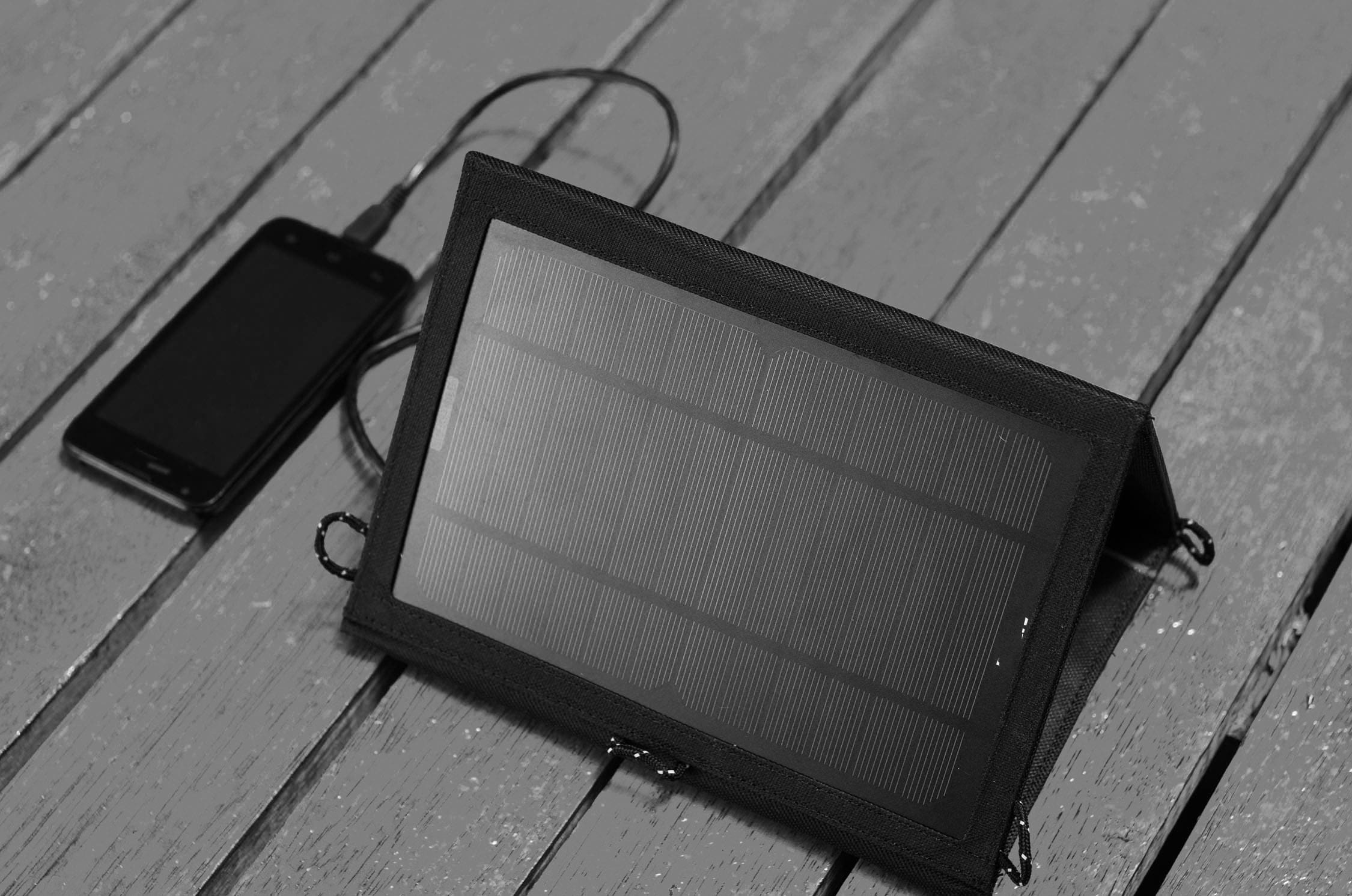 Smart phone being charged using solar power