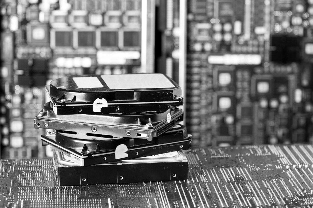 Multiple hard drives stacked on top of a printed circuit board
