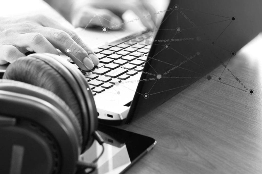 person working on a laptop at a desk