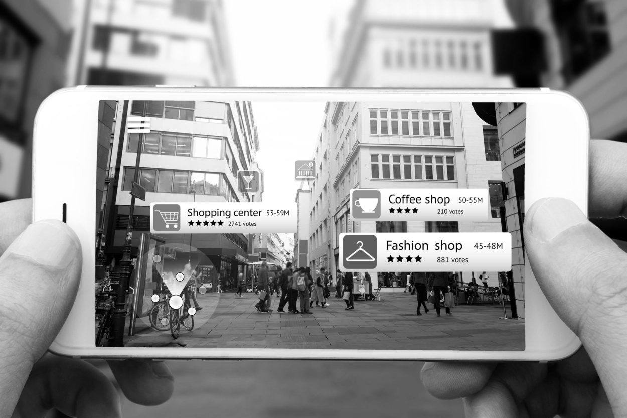 a picture of a city street on a smartphone overlayed with augmented reality data