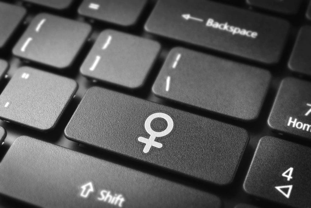 keyboard with one of the keys labeled with a gender symbol