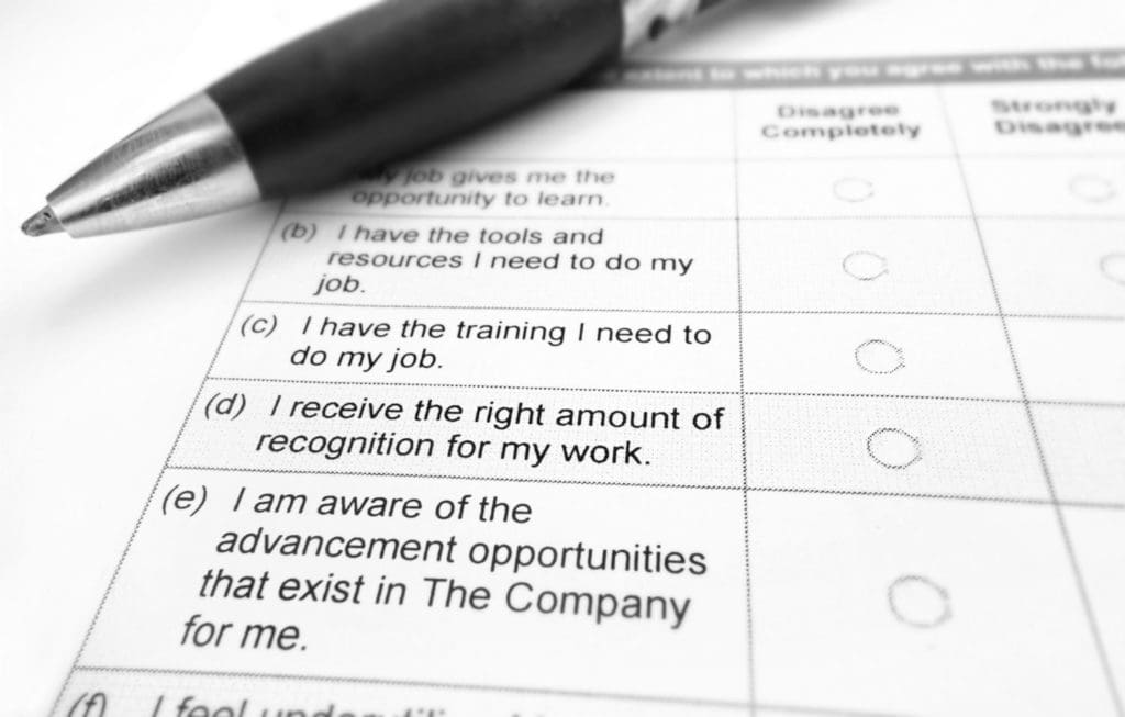 closeup of a pen on top of a job satisfaction survey