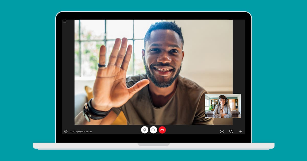 Image of a black man on a computer screen waving to a white female interviewer in the bottom right hand of the screen to signify a virtual interview